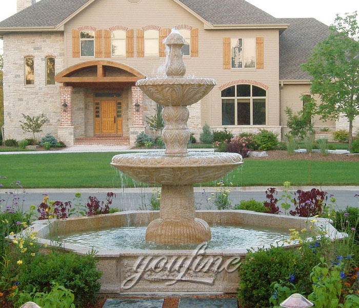 Outdoor three tiers natural beige marble features in the front of the hotel